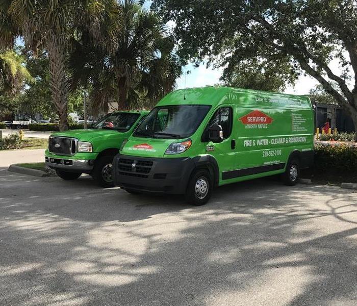Two SERVPRO vehicles parked.
